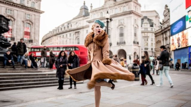 old fashioned woman in piccadilly circus